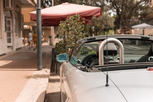 Close-up detail of a classic convertible car in a park.there is a place for an inscription. High quality photo