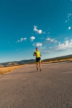 Triathlete in professional gear running early in the morning, preparing for a marathon, dedication to sport and readiness to take on the challenges of a marathon