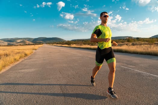 Triathlete in professional gear running early in the morning, preparing for a marathon, dedication to sport and readiness to take on the challenges of a marathon