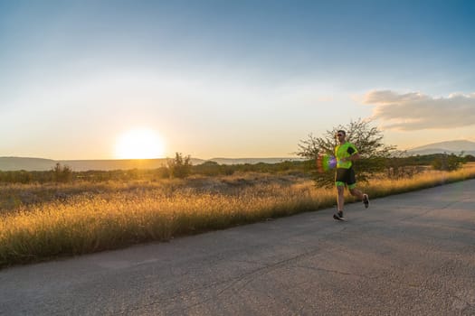 Triathlete in professional gear running early in the morning, preparing for a marathon, dedication to sport and readiness to take on the challenges of a marathon