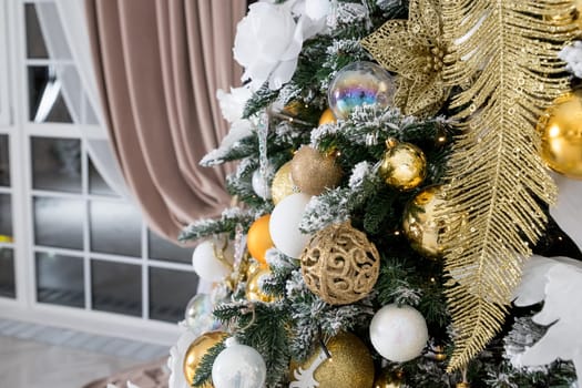 Christmas background. Christmas boarder with fir tree branch with cones and ornament. Christmas baubles in golden and red colour.