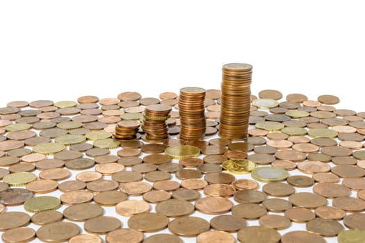 Stacks of gold coins. Gold coins on a white background. Money on a white background. Copy space. Treasure hunt. The chalk was erased on the board. Board background. High quality photo