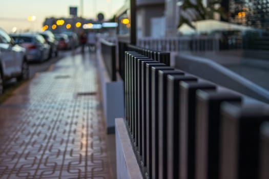 fence on the street in the city, there is a place for an inscription. High quality photo