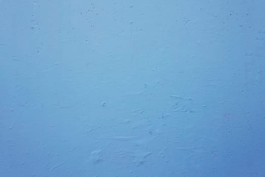 Texture of an old, shabby blue wall.