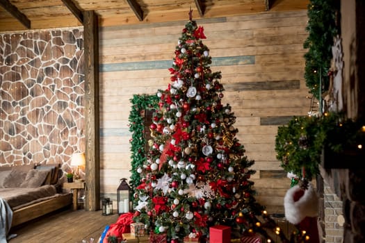 Christmas, New Year loft interior with large window, black wall background, garlands, fir tree with lamps and Christmas gifts, bed with checkered plaid