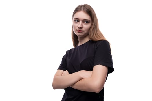 European schoolgirl girl with brown hair looks arrogantly to the side.