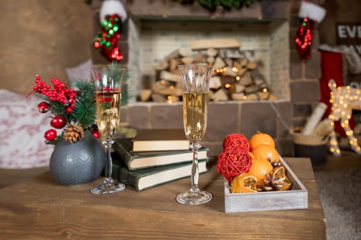 Picture of Christmas table setting, retro style photo, glasses for champagne, golden Christmastime decorations