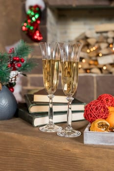 Picture of Christmas table setting, retro style photo, glasses for champagne, golden Christmastime decorations