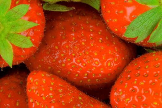 Color macro shot of strawberries. Snapshot of strawberries suitable as a concept for summer, summer refreshment, evening garden party. Concept for restaurants, ice cream shops and fruit bars. Close-up, top view, flat design.