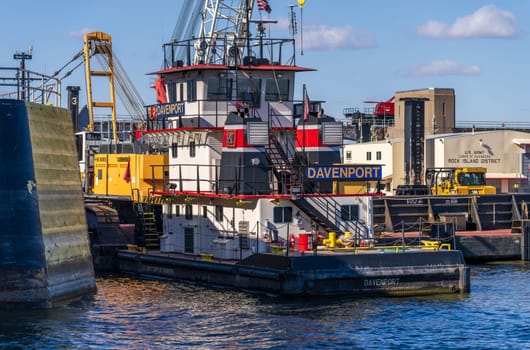 Hannibal, MO - 20 October 2023: Davenport tug and large crane working to renovate Lock and Dam no. 12 on Upper Mississippi