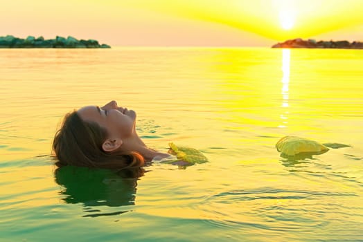 Beautiful girl is relaxing in the, swim and relax