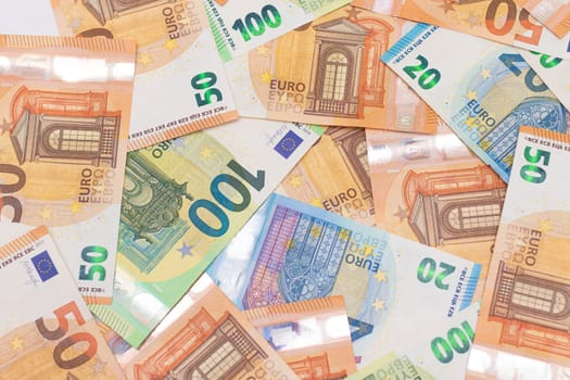 Different Euro Banknotes Money Background. Euro Money Currency. Colored Paper Money. A Lot of Fifty Euro Bills. Business, Finances, Cash and Money Saving Concept