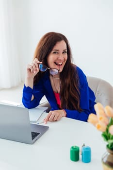 Business woman working online on laptop