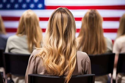 Blonde girl against the background of a blurred US flag.