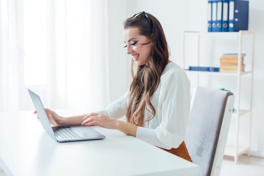 woman with laptop learning to work online