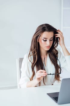 woman with laptop learning to work online