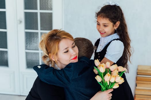 Children congratulating the teacher on the holiday class