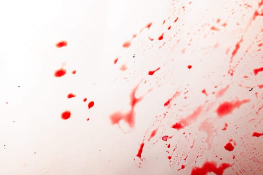 red currant juice on white background looks like a blood splashes.