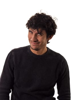 A man with curly hair is smiling to the camera, isolated on white