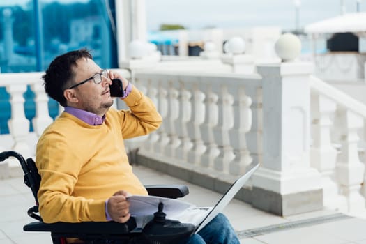 A person with a laptop and a phone