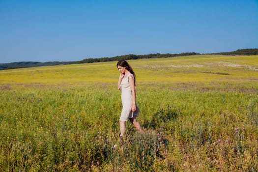 Portrait of a beautiful girl in a rural field