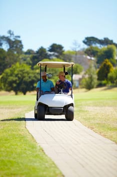 Man, friends and driving golf cart on course outdoor for sports match, golfing or exercise together. Male person, athlete or professional golfer riding to next pitch for easy transportation or game.