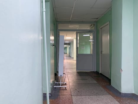 11.13.2023, Kemerovo, Russia. Empty corridor of an old hospital. hospital corridor with offices, old hospital, scary atmosphere