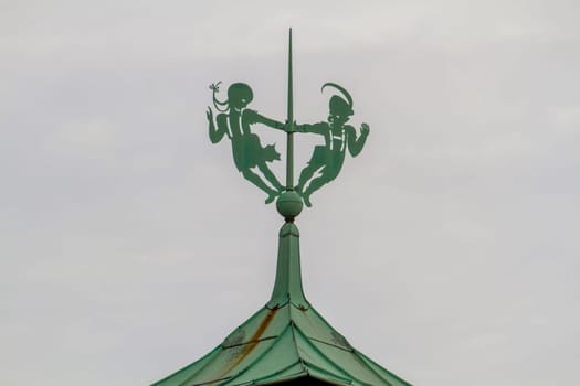 Fgures on the spire of a German house. High quality photo
