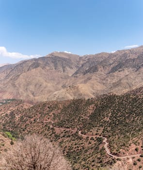 Scenic mountain landscape at Tizi n'Test pass in the Atlas mountains, the road meanders upwards, Morocco