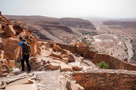 Hiking through the old Id Aissa agadir, an old granary in Amtoudi, Morocco