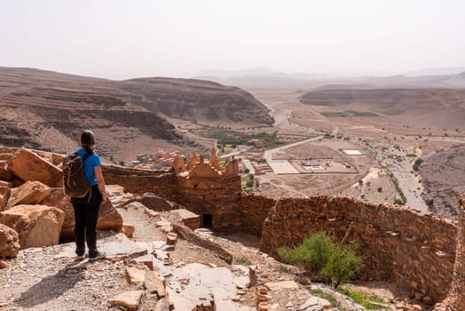 Hiking through the old Id Aissa agadir, an old granary in Amtoudi, Morocco