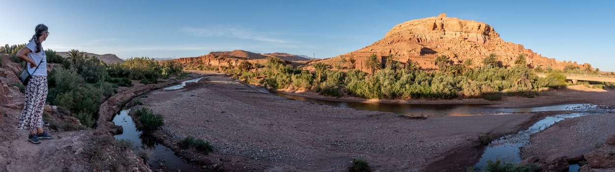 Sunset over the beautiful historic town Ait Ben Haddou in Morocco, famous berber town with many kasbahs built of clay, UNESCO world heritage