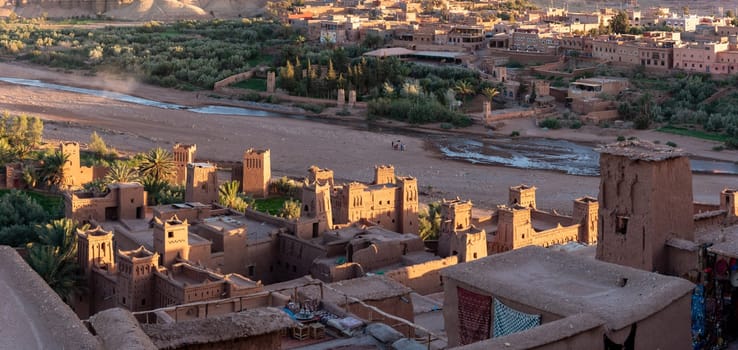 Sunset over the beautiful historic town Ait Ben Haddou in Morocco, famous berber town with many kasbahs built of clay, UNESCO world heritage