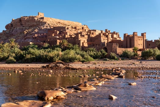 Sunrise over the beautiful historic town Ait Ben Haddou in Morocco, famous berber town with many kasbahs built of clay, UNESCO world heritage