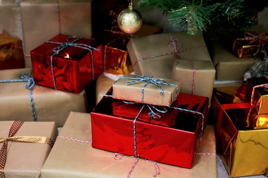 Various gift boxes under a decorated Christmas tree. Holiday concept.