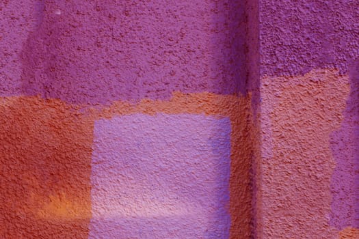 Old cement wall texture. A wall with large square-shaped spots.