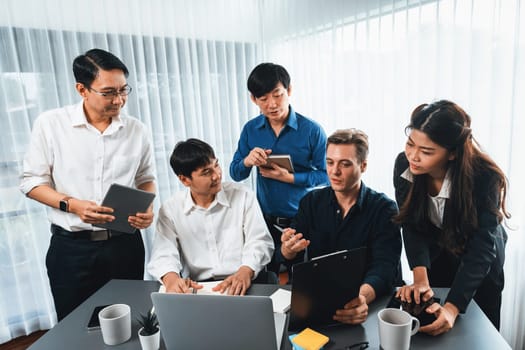 Group of diverse office worker employee working together on strategic business marketing planning in corporate office room. Positive teamwork in business workplace concept. Prudent