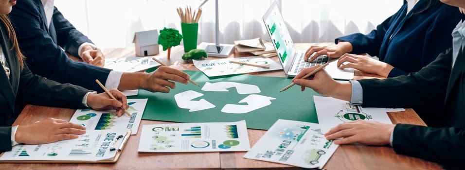 Group of business people planning and discussing on recycle reduce reuse policy symbol in office meeting room. Green business company with eco-friendly waste management regulation concept.Trailblazing