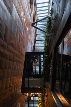 Indoor trees Modern interior design in European Solidarity Centre Gdansk Poland. Biophilia design connecting with nature green areas. Modern abstract museum in Europe. Travel destination tourist attraction