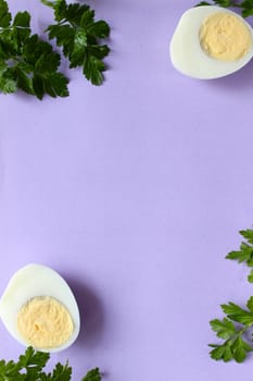 Boiled chicken egg and parsley on a purple pink background. High quality photo