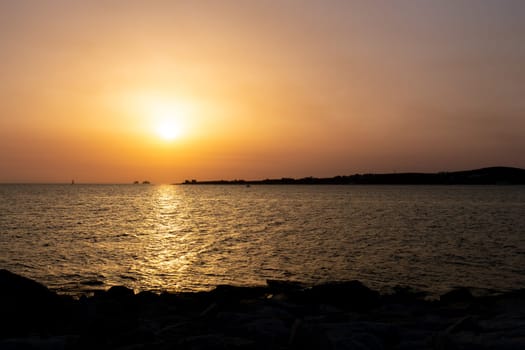 View of the sea at sunset in Paros, Greece