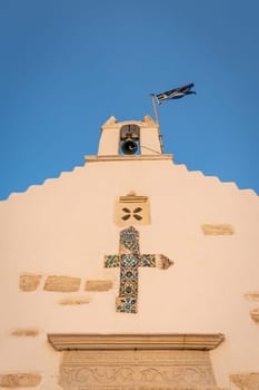 Sunset view of Saint Constantine Panoramic Church from the harbor