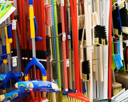 Large assortment of brushes for cleaning premises in store. Trade in floor cleaning equipment