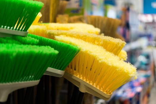 Large assortment of brushes for cleaning premises in store. Trade in floor cleaning equipment