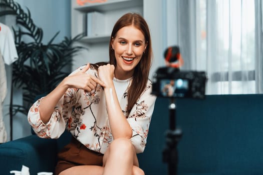 Woman influencer shoot live streaming vlog video review makeup utmost social media or blog. Happy young girl with cosmetics studio lighting for marketing recording session broadcasting online.