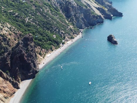 Aerial panoramic view of beautiful sunset above sea. Beautiful seascape. Sun glare, small waves on the water surface. Evening. Horizon. Nobody. No people. Copy space. Never-ending beauty of nature