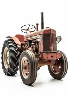Very old rusty red tractor isolated on white background, vertical.
