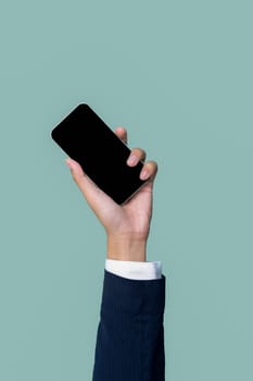 Hand holding smartphone device on isolated background for start up mobile tech company. Eco-friendly green business promoting electronic waste policy idea. Quaint