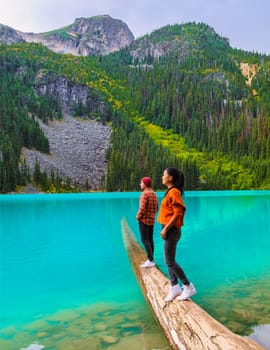 Joffre Lakes British Colombia Whistler Canada, a colorful lake of Joffre Lakes National Park in Canada. A couple of Asian women and caucasian men walking at Jofre Lake BC Canada