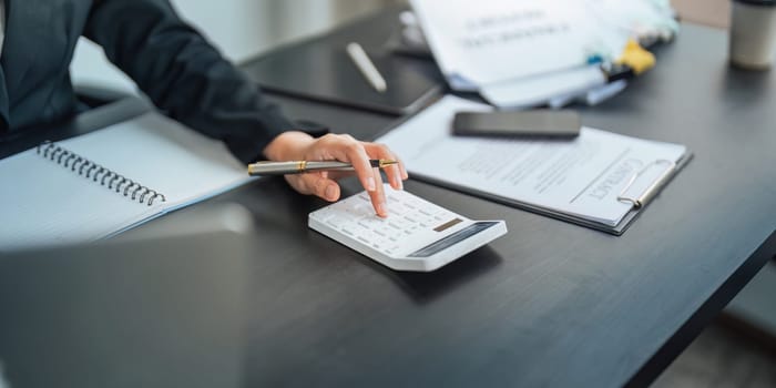 Close up of businessperson analysis and calculate chart and graph showing change and growth on the finance and marketing.